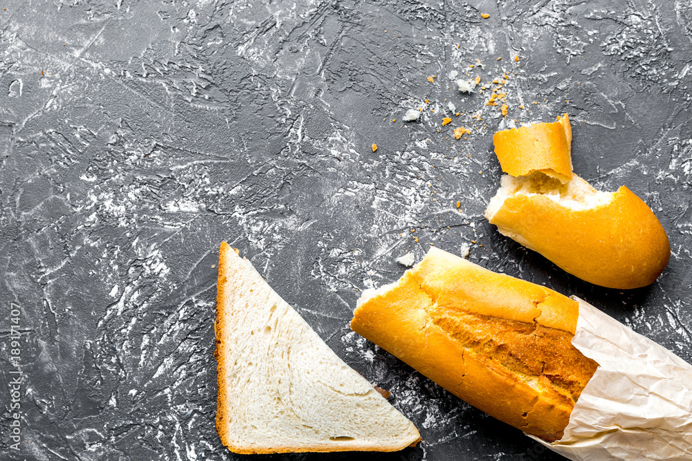 bread and paper bag on gray desk background top view mock-up