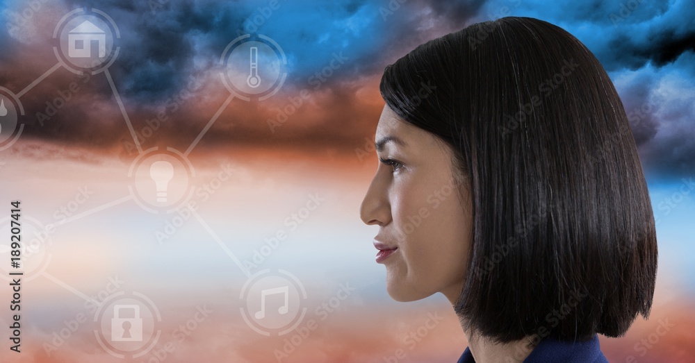 Woman looking at interface in clouds