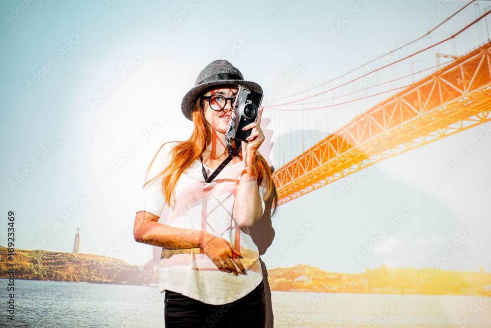 Portrait of a young woman traveler with projected image of landscape view on the famous bridge in Li