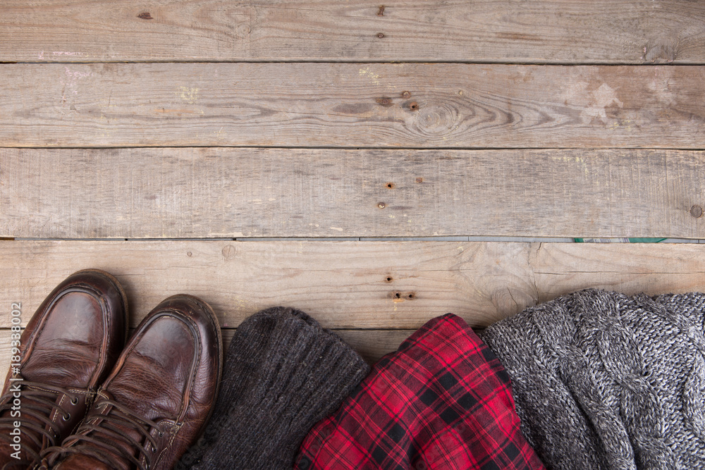 knitted winter sweater on wooden background