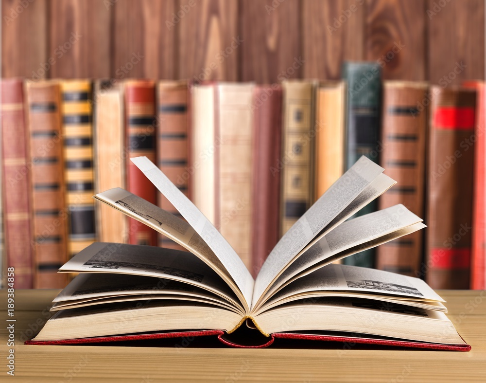 Open book on wooden table