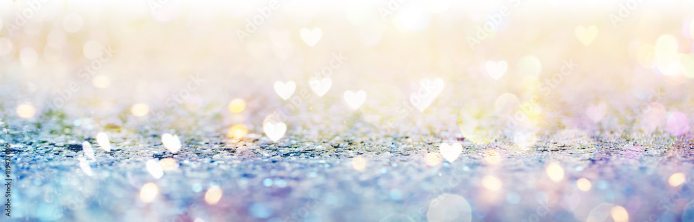 Beautiful shiny hearts and abstract lights background