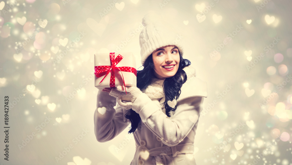 Young woman holding a Christmas gift box