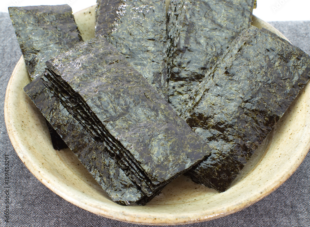 Nori , Japanese edible seaweed . Used chiefly as an ingredient wrap of sushi