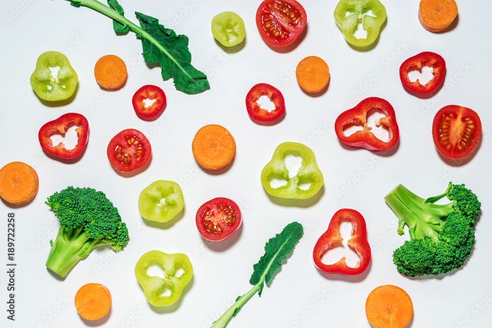 Assorted sliced vegetables on white background.  Flat lay. Food vegan concept.