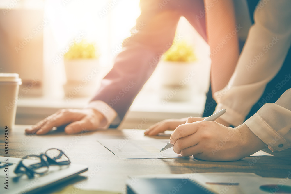 Man and woman working in office