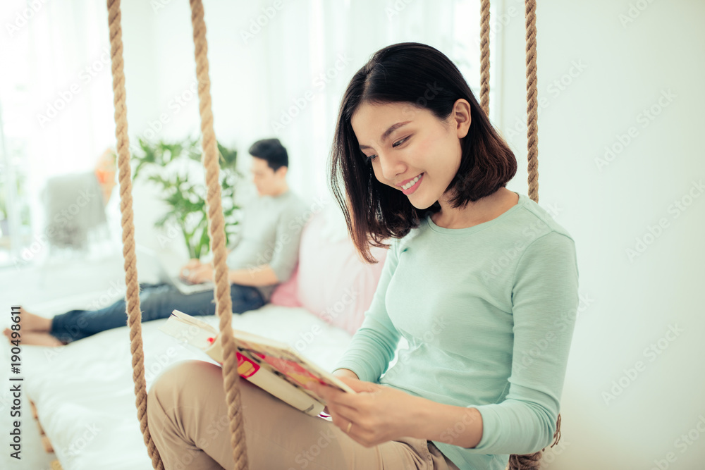 Young pretty asian woman at home relaxing