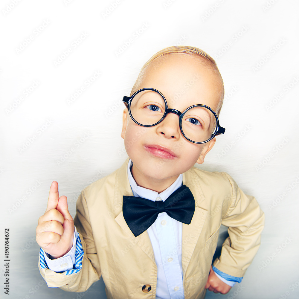 Studio shot of little boy posing confidently