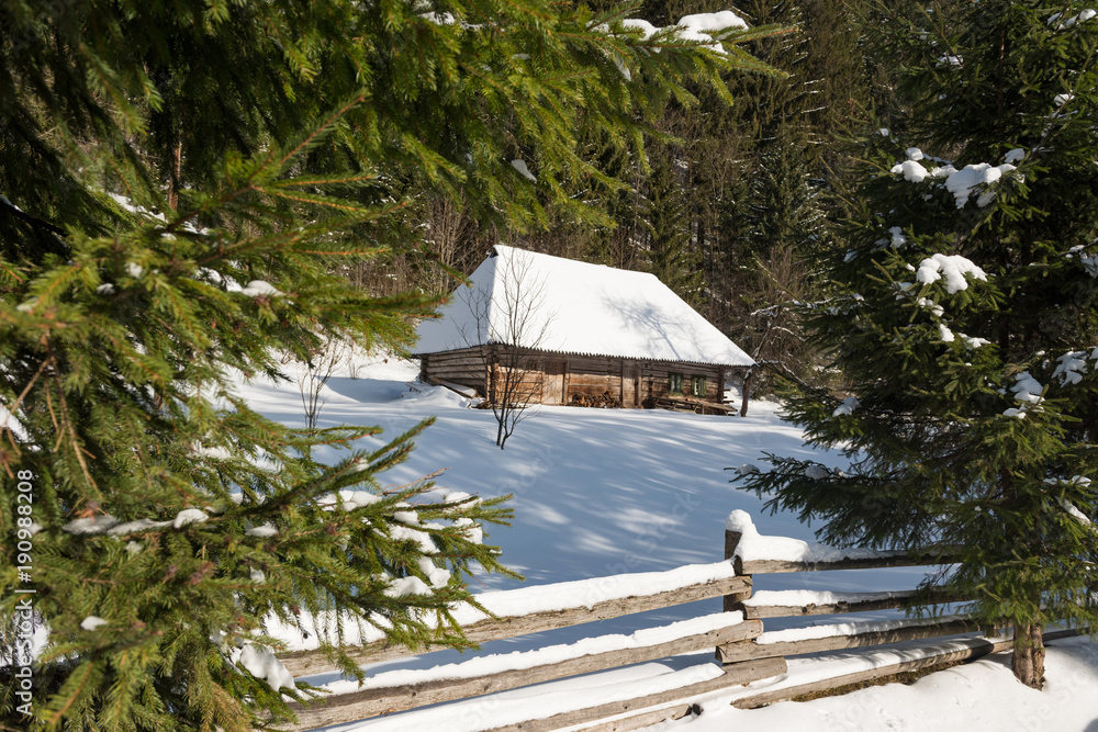 Old wooden house in the winter