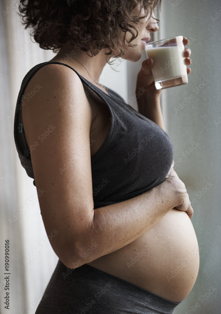 Pregnant woman drinking milk