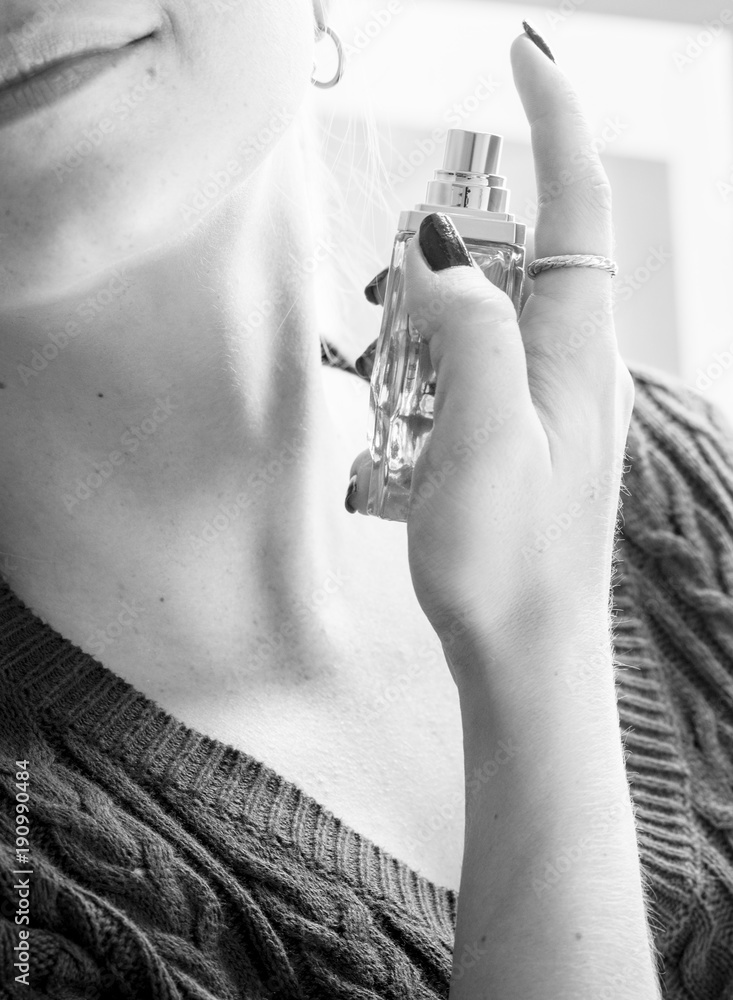 Woman using a perfume