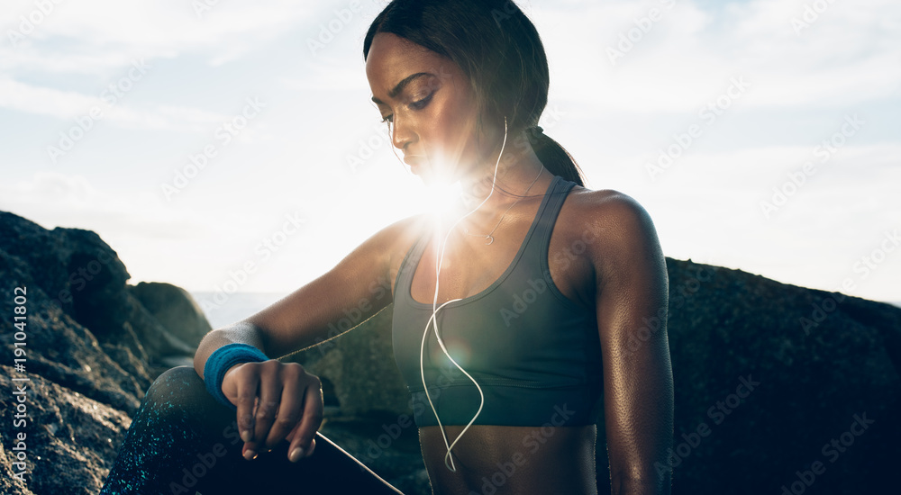 Woman runner relaxing after workout