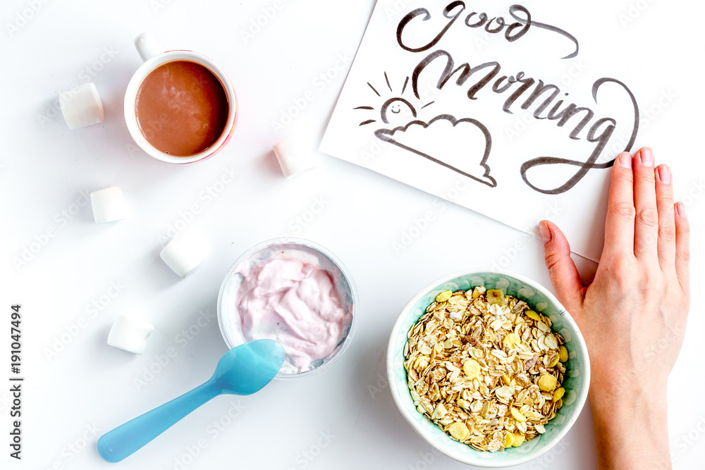 concept kid breakfast with yogurt top view white background