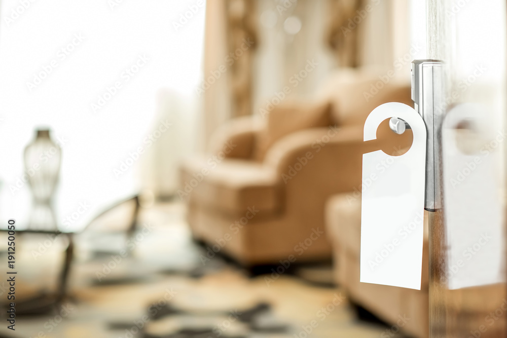 View on the hotel room through the open door with empty paper handle to copy paste