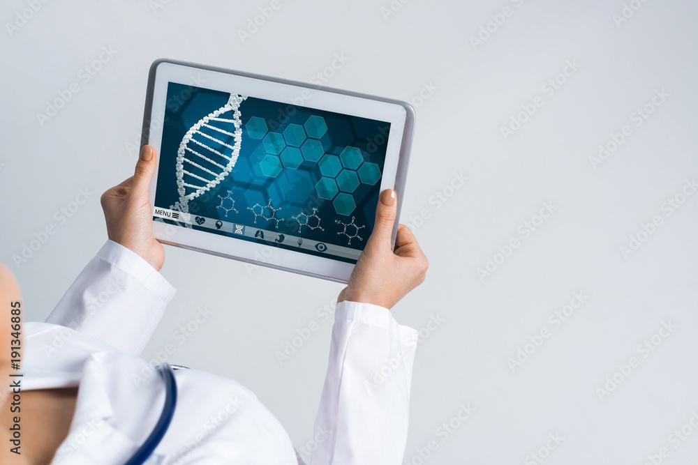 Close of female doctor hands working with tablet pc computer