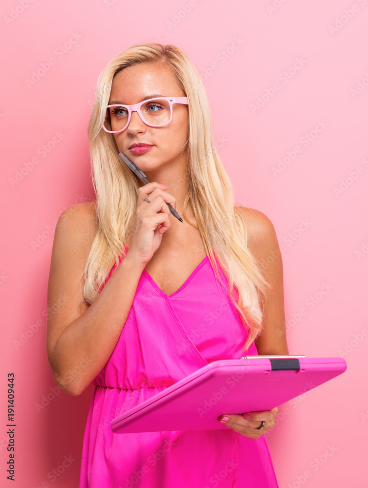 Office woman with a clipboard on a solid background