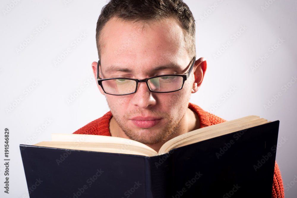 The guy is reading a book