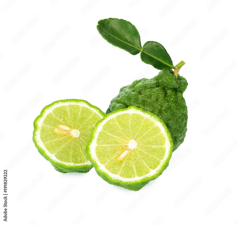 Half of bergamot and a whole bergamot with leaf isolated on white background.