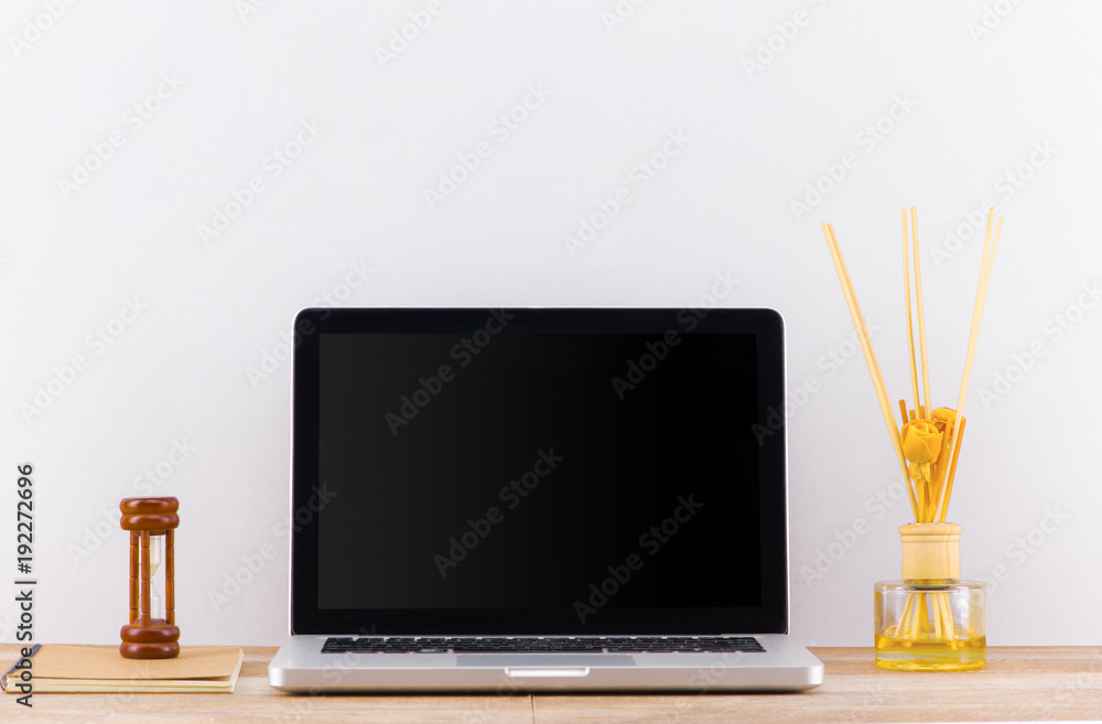 laptop computer white blank screen on work table front view