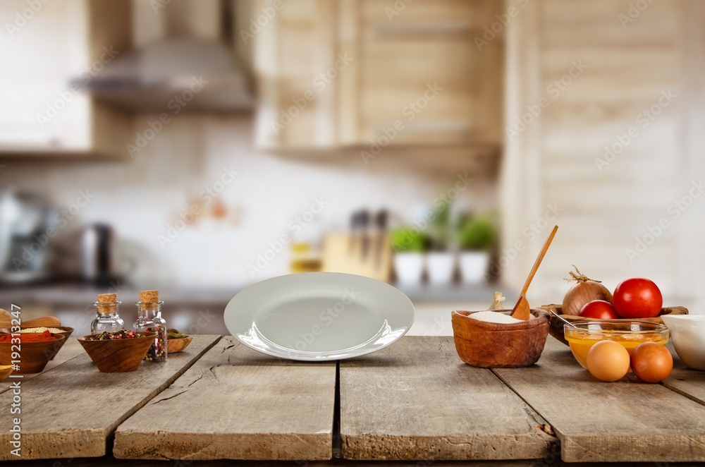 Food ingredients in kitchen placed on wooden plank