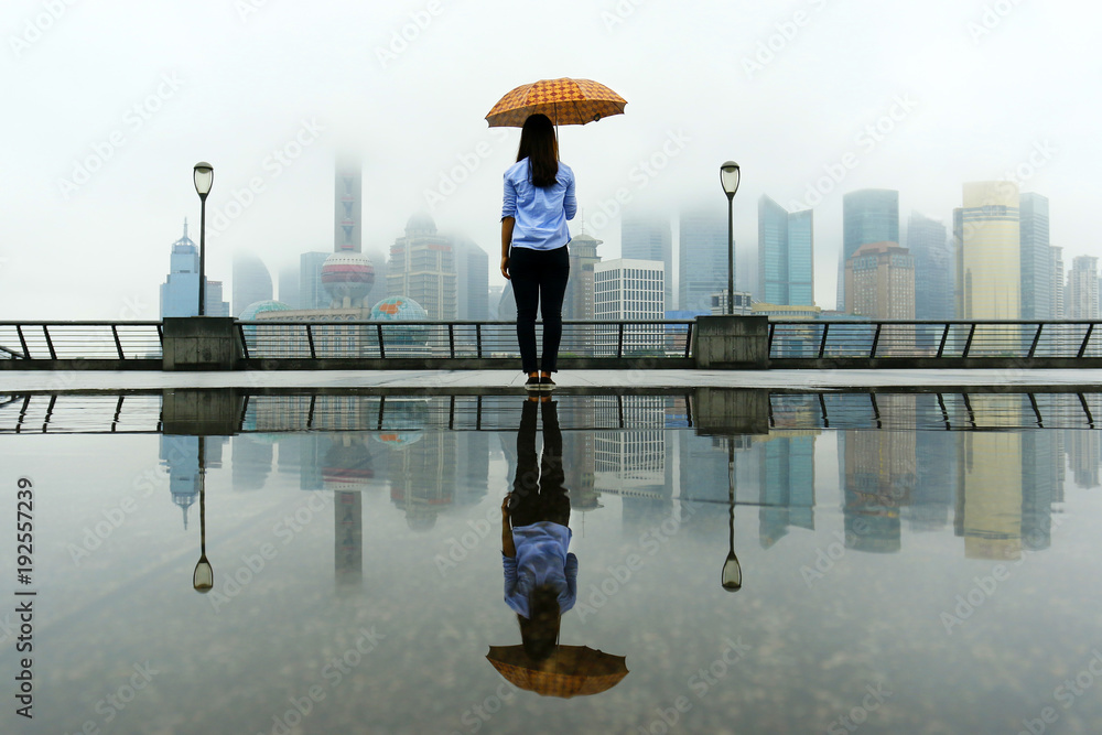 Someone watching the building of Pudong , with umbrella in Shanghai, china…