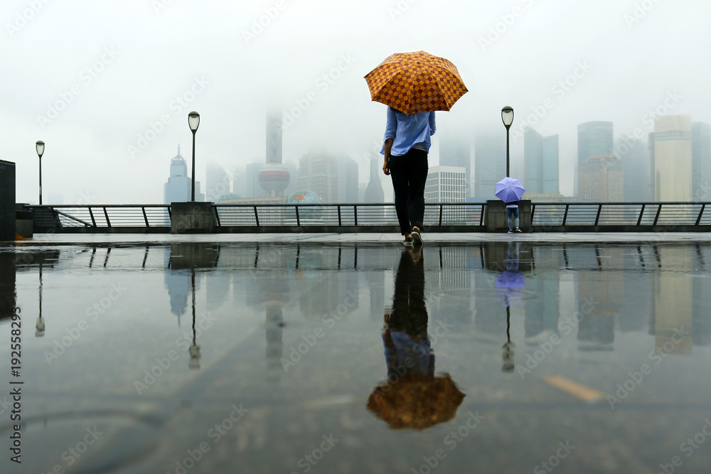 Someone watching the building of Pudong , with umbrella in Shanghai, china…