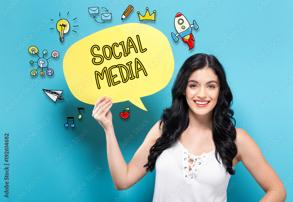 Social Media with young woman holding a speech bubble