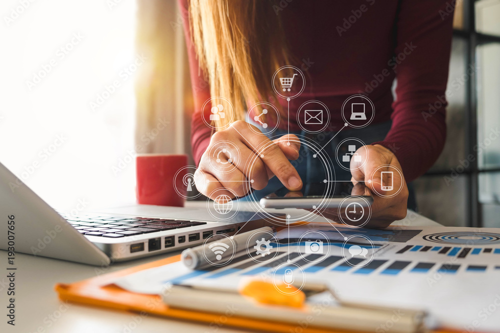 designer woman using smart phone for mobile payments online shopping,omni channel,sitting on table,v