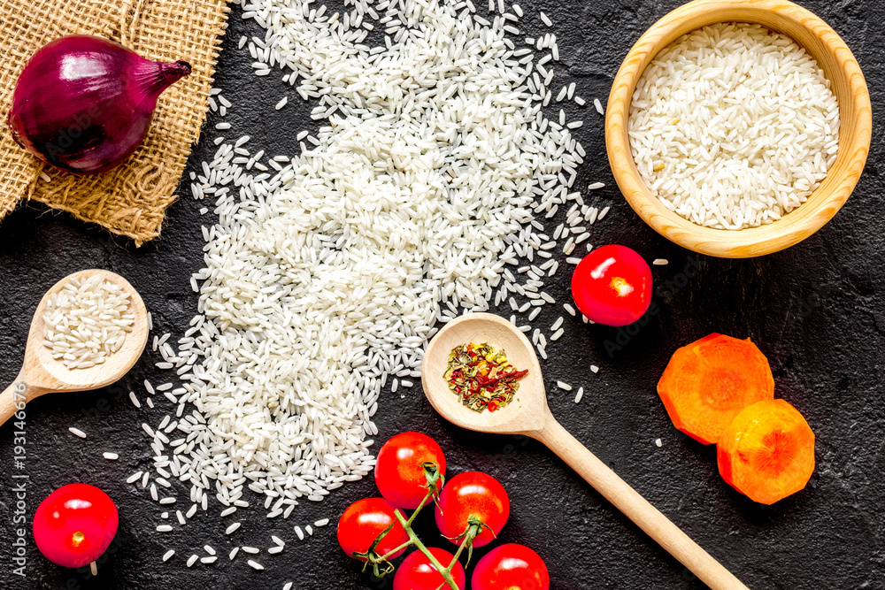 ingredients for paella on dark background top view