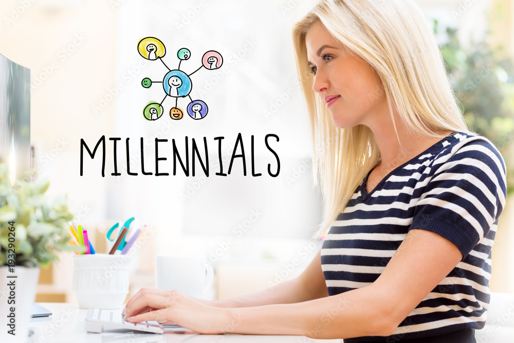 Millennials with happy young woman sitting at her desk in front of the computer