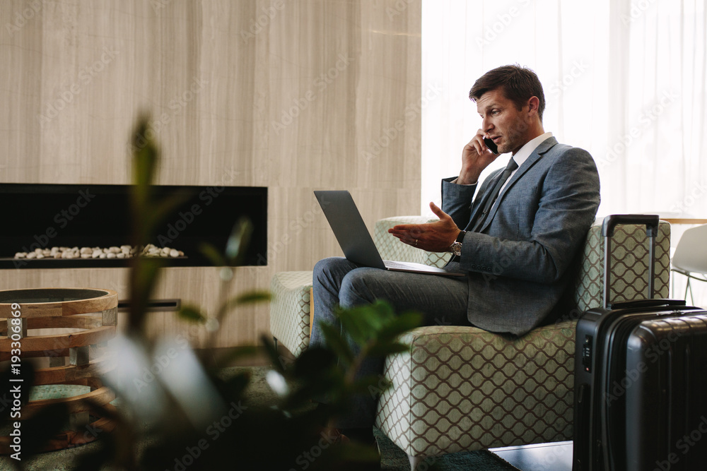 Entrepreneur working at waiting room in airport terminal