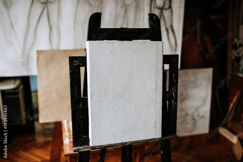 Blank canvas. Artistic equipment in a artist studio.