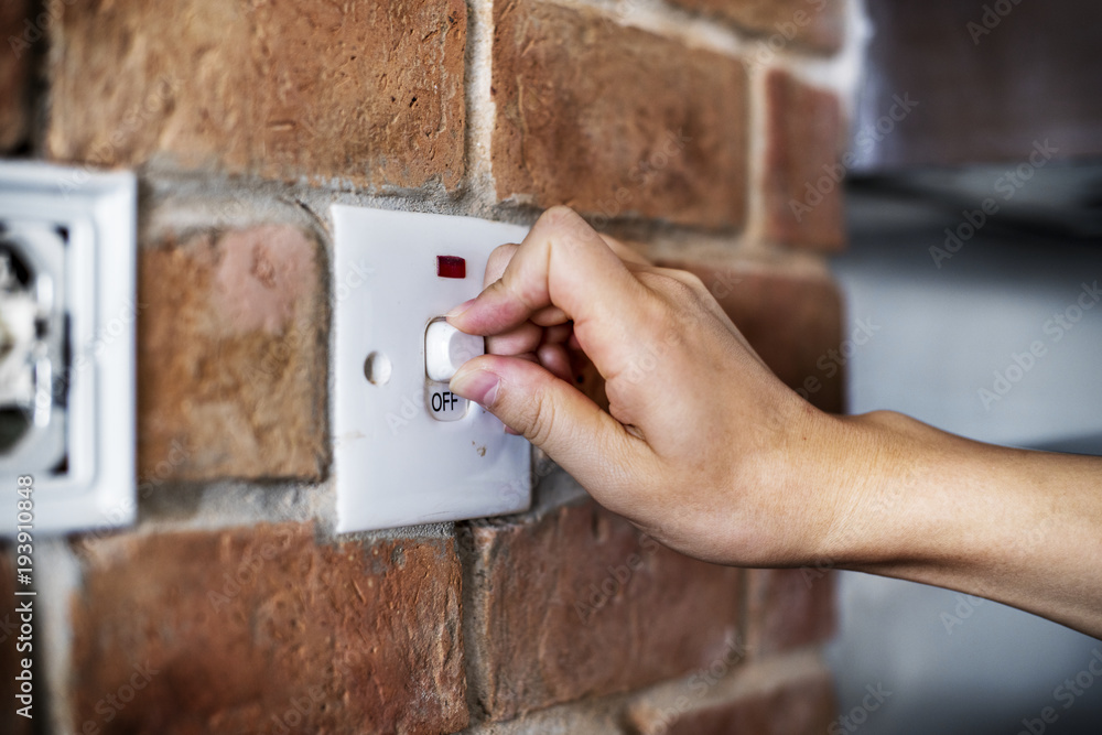 Closeup of switch on brick wall