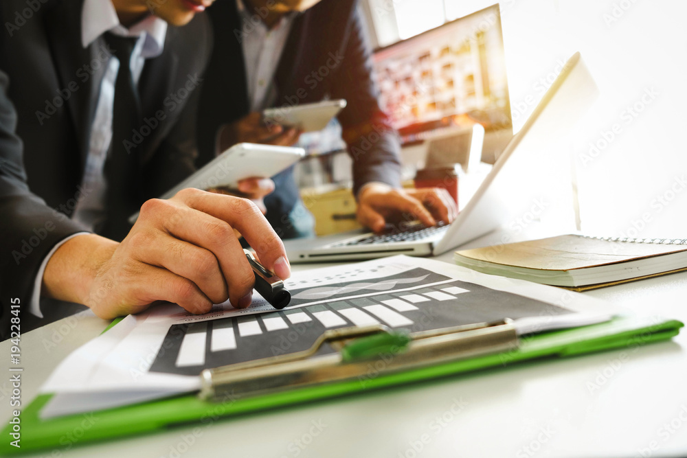 Working team meeting concept,businessman using smart phone and laptop and digital tablet computer in