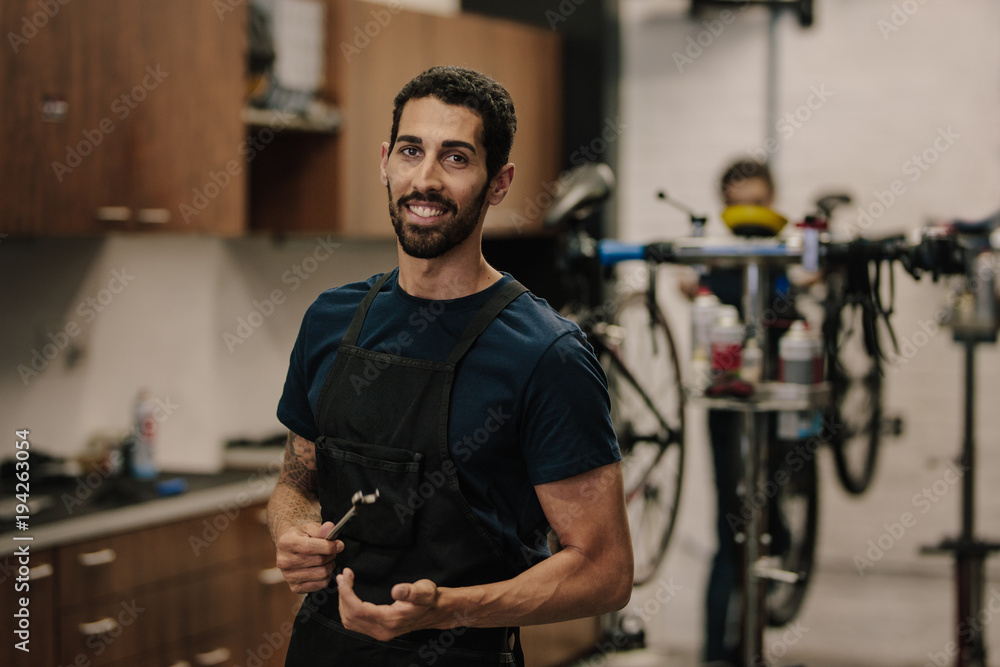 Workers repairing bicycles in workshop