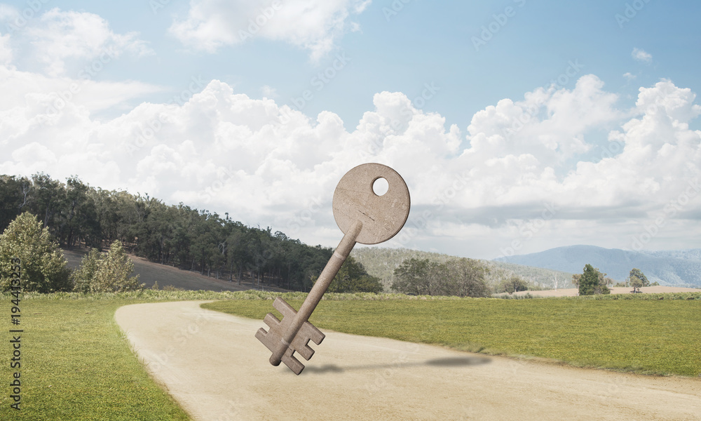 Conceptual background image of concrete key sign on country road