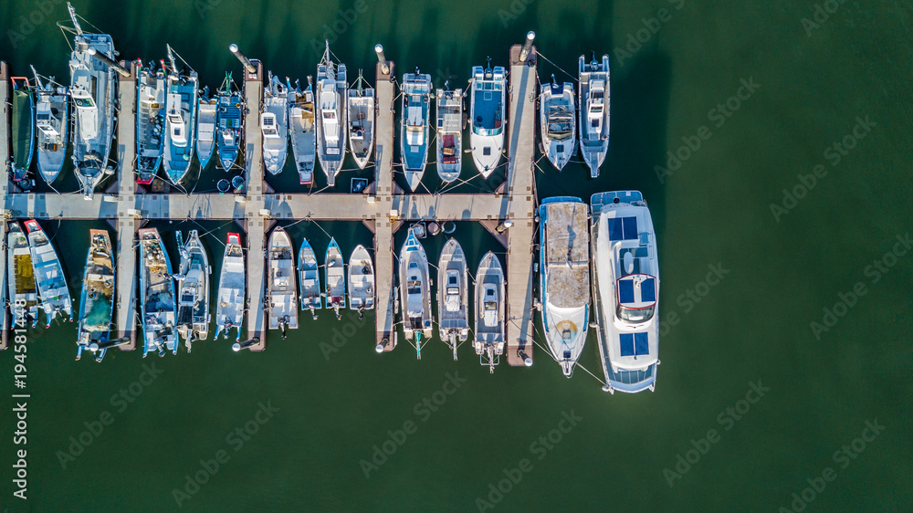 Aerial view Yacht parking, A marina lot, Yacht and sailboat is moored at the quay, Aerial view by dr