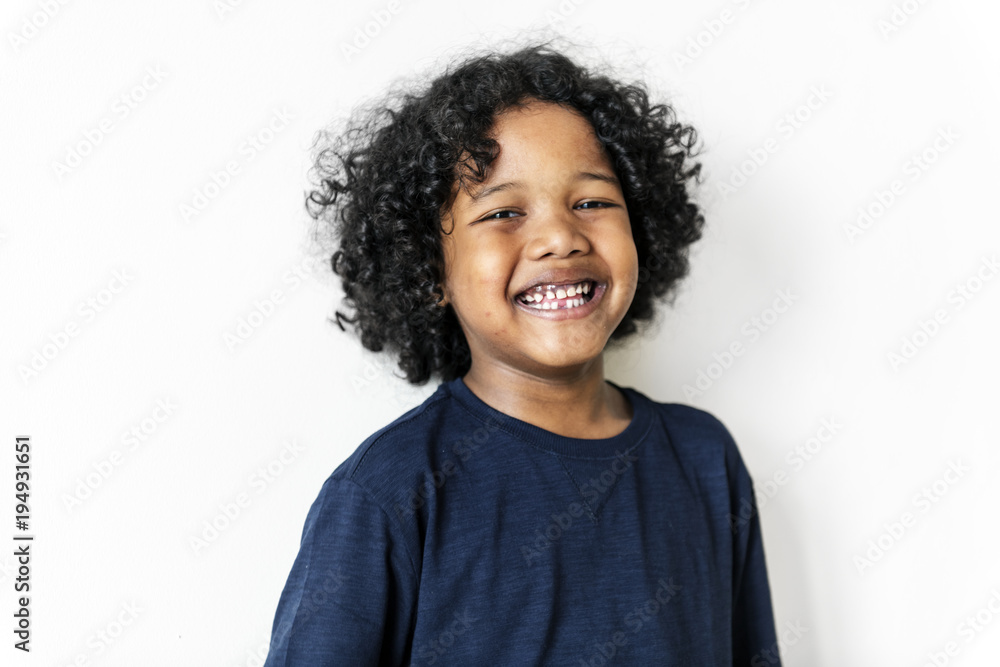 Portriat of young cheerful black boy