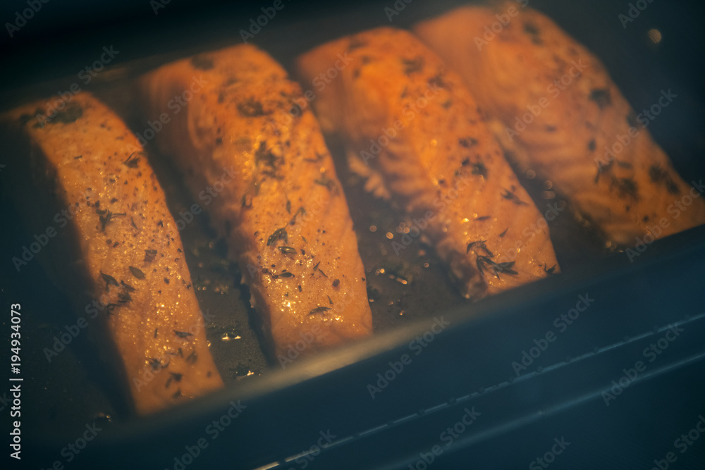 Raw salmon preparing to be cooked