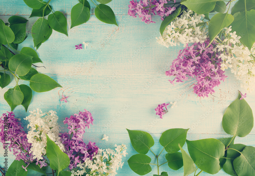 view to lilac flowers on old wooden background. Spring blossom on blue surface