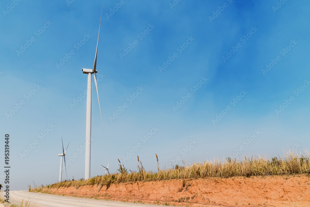 concept idea eco power energy. wind turbine on hill at thailand