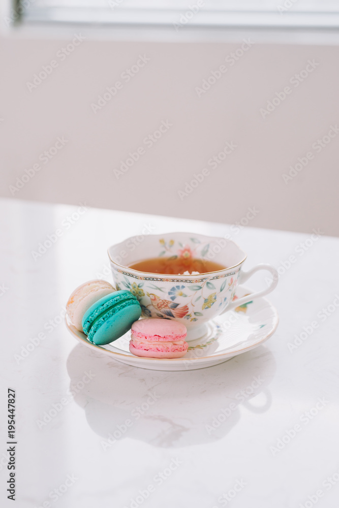 Sweet dessert. Colorful macarons on table in morning.