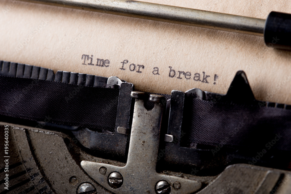 Time for a break - text message on the typewriter close-up