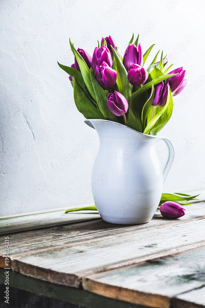 A bouquet of purple tulips in a vase