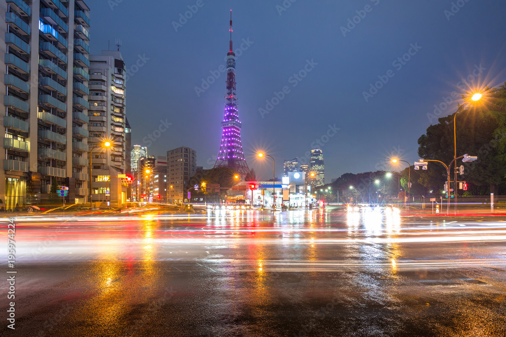 Cityscape of busy street with Tokyo tower at night, Japan