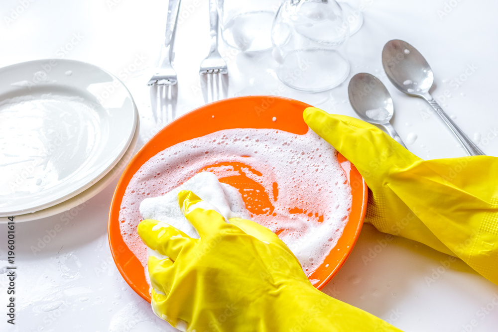 concept of woman washing dishes on white background