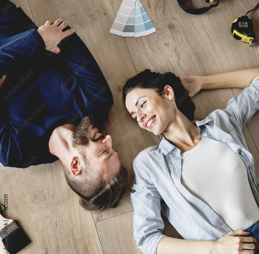 Family lying on wooden floor