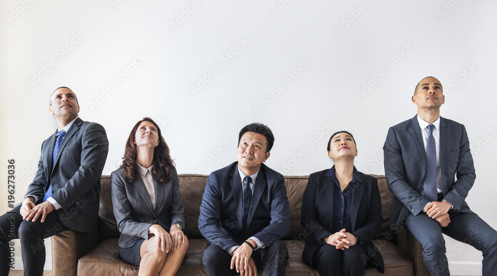 Business people sitting together on couch