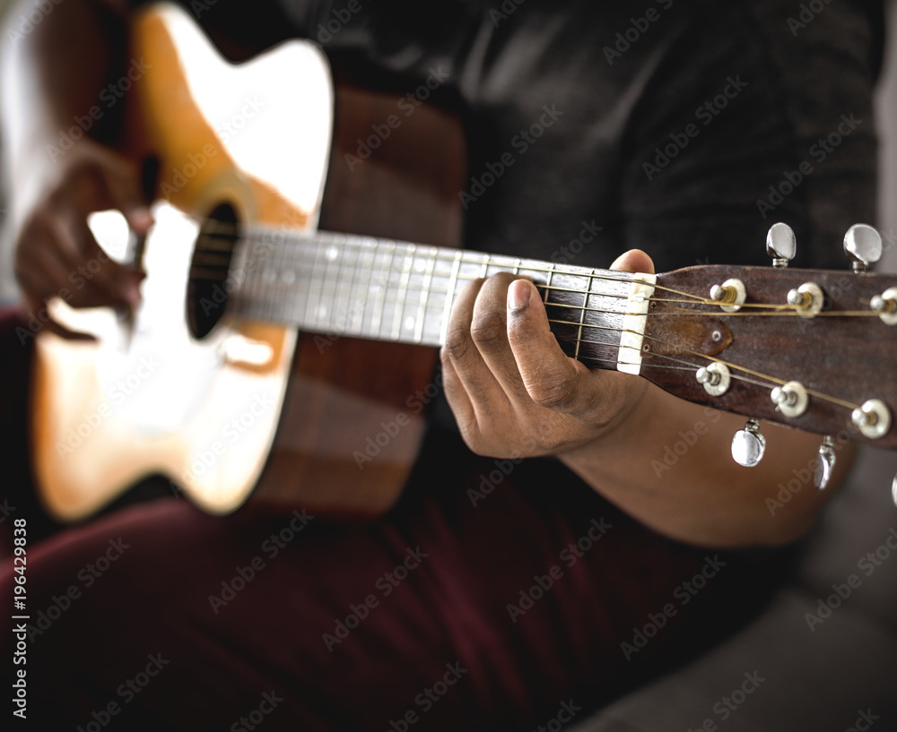 Man playing an acoustic guitar