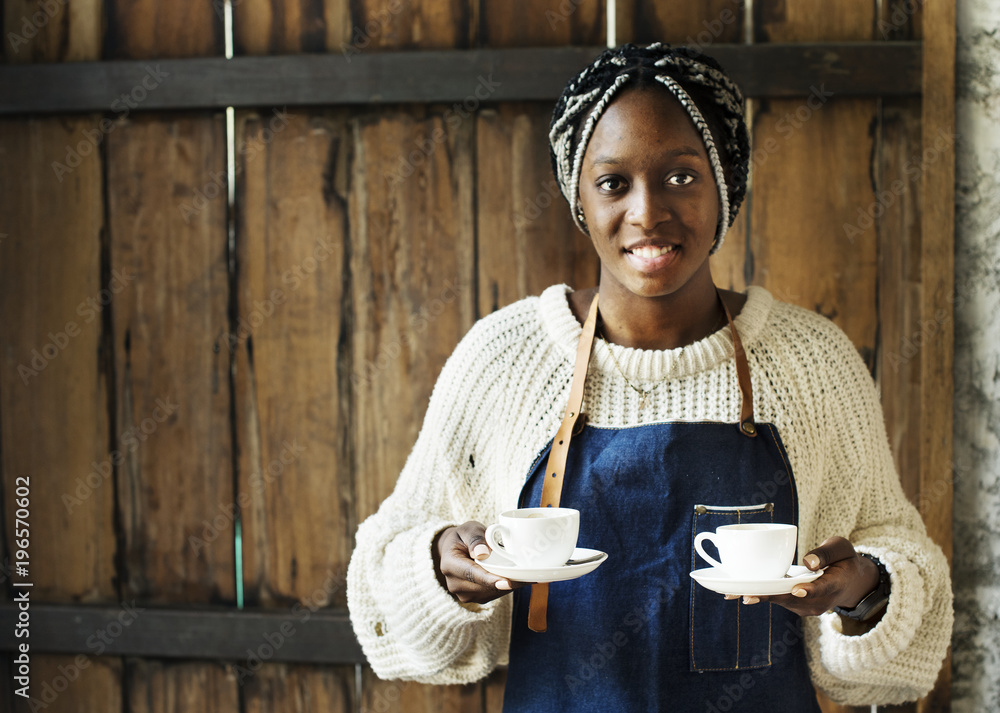 A barista serving coffee